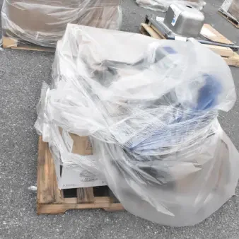 11 brand new scratch and dent items, including a Switch Kit, plates, and bowls, wrapped on a pallet.