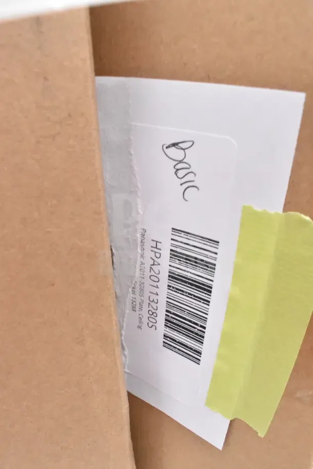 Box with a label showing "Basic," barcode HPA201132805, and item details. Contains new scratch and dent items.