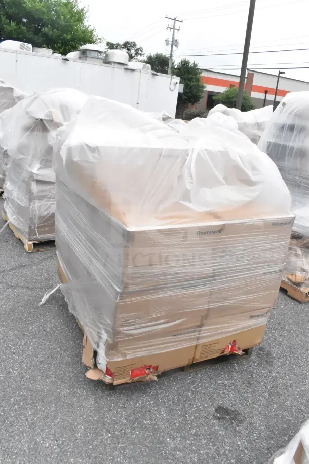 Shrink-wrapped pallet of Honeywell N95 respirator boxes, scratch and dent condition, 22 boxes total.