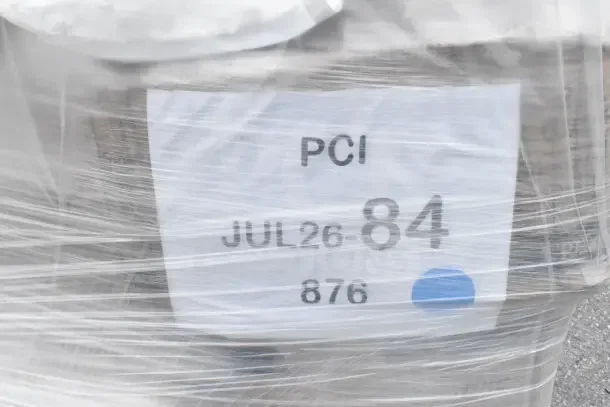 "Scratch and Dent" shipment wrapped in plastic, labeled "PCI JUL26-84, 876," includes glass rack, plates, and condiment caddy.