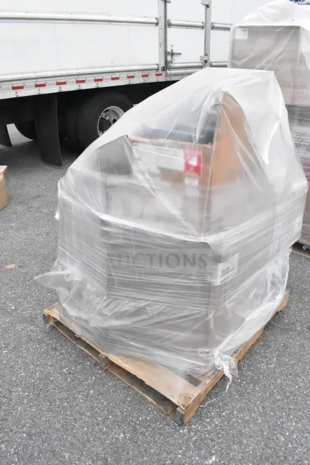 Pallet of 10 brand new scratch and dent items, wrapped in plastic, labels visible. Auction: 10 times your bid value.