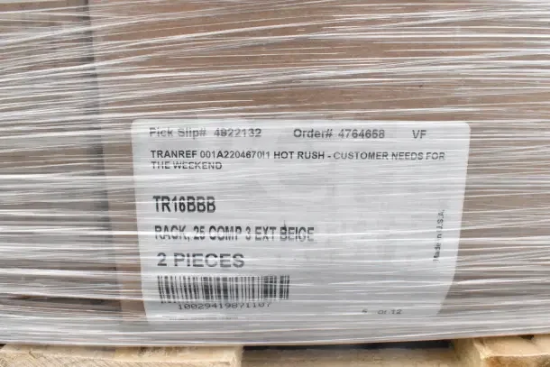 Pallet wrapped in plastic, containing 34 brand new scratch and dent items, including glass caddies. Label shows order and pick slip numbers.