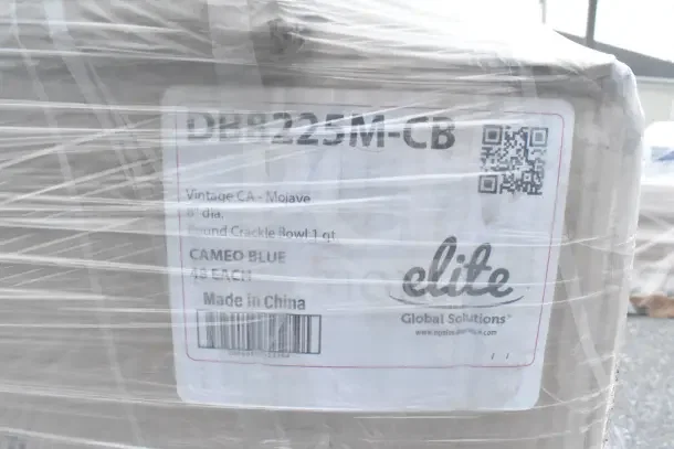 26 brand new scratch and dent items wrapped in plastic. Label reads: DB8225M-CB, Cameo Blue crackle bowls, Elite brand, made in China.