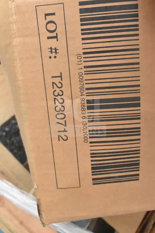 Cardboard box labeled "LOT #: T23230712" with visible barcode. Contains 10 brand new scratch and dent items, including 2100718 disposal partition and 2785888 World dinner forks.