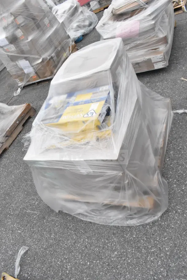 Auction lot of 9 brand new items including T&S G-2C-48K gas hoses and 10211301 water softener, wrapped on a pallet.