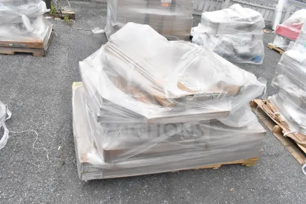 16 brand new scratch and dent items on a pallet, wrapped in plastic, including wire shell and doughnut fryer screen.