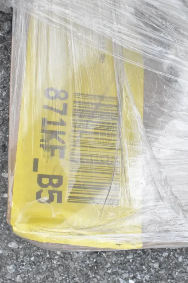 Plastic-wrapped package with barcode visible. Includes wire shell, doughnut fryer screen, Eagle CSI-1448 shelf inlay. Scratch and dent items.