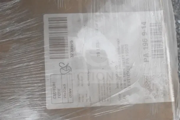 "Sealed package with shipping label showing details of 16 new scratch and dent items, including a Wire Shell and Eagle CSI-1448 Shelf Inlay."