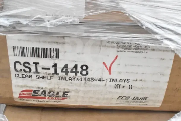 Cardboard box labeled "Eagle Group CSI-1448 Clear Shelf Inlay" with barcode and contact details; quantity marked as 11.