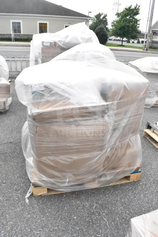 Pallet with 7 new scratch and dent items, wrapped in plastic. Includes sink and filler table.