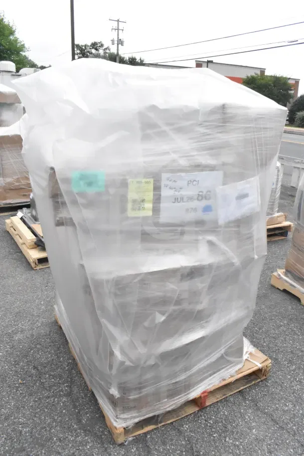 Pallet of 21 new scratch and dent items including grinder plates, divider bar, wine glasses. Wrapped and labeled "JUL26-86."