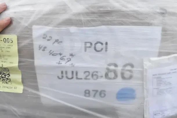 Plastic-wrapped pallet labeled "21 BRAND NEW SCRATCH AND DENT!" including grinder plates, divider bar, wine glasses.