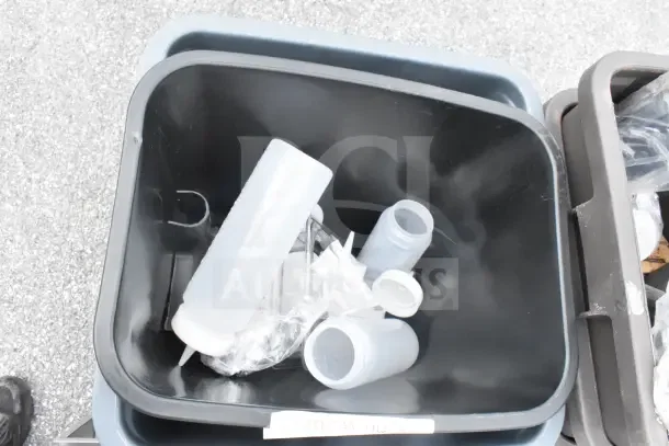 Three brand new scratch and dent items including trash cans with labels and various accessories inside.