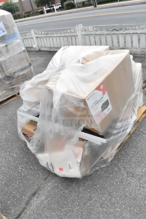 Pallet of 21 scratch and dent items wrapped in plastic, including a Camkettle Lid Organizer box and assorted kitchenware.