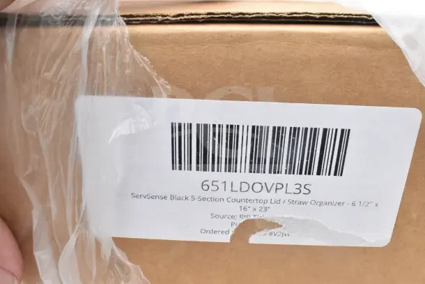 Cardboard box with a label reading "ServSense Black 5-Section Countertop Lid/Straw Organizer, 16" x 23"."