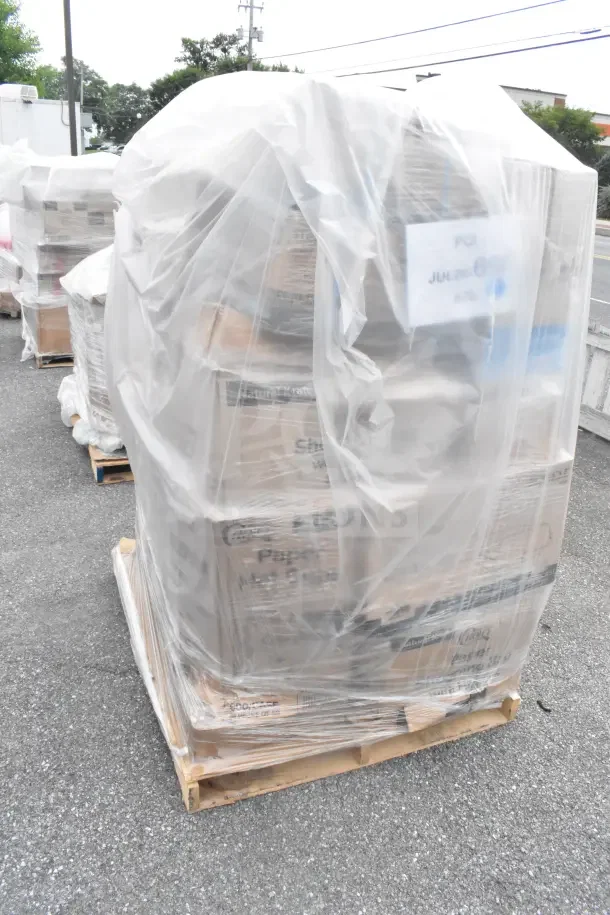 Pallet with 29 new scratch and dent items wrapped in plastic, including wax paper, portion cups, lids, and paper towels.