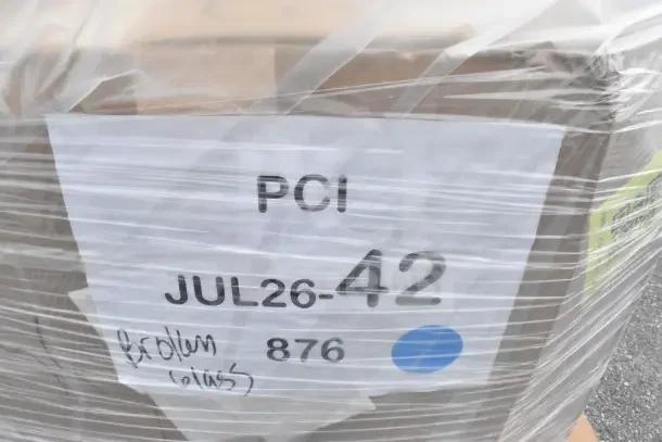 Plastic-wrapped package labeled "PCI JUL26-42 876," with "broken glass" note, containing new Hatco GRHD-3PD merchandiser.