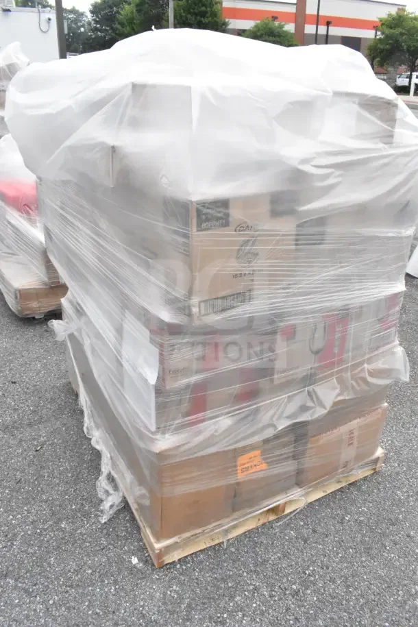 Pallet wrapped in plastic with boxed items labeled "45 BRAND NEW SCRATCH AND DENT" including glasses, spoons, and a French food mill.