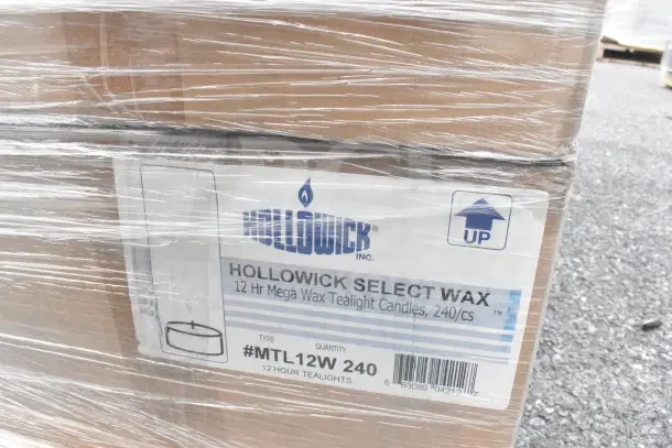 Cardboard box containing Hollowick Select Wax 12-hour tealight candles, labeled with product details under plastic wrap.