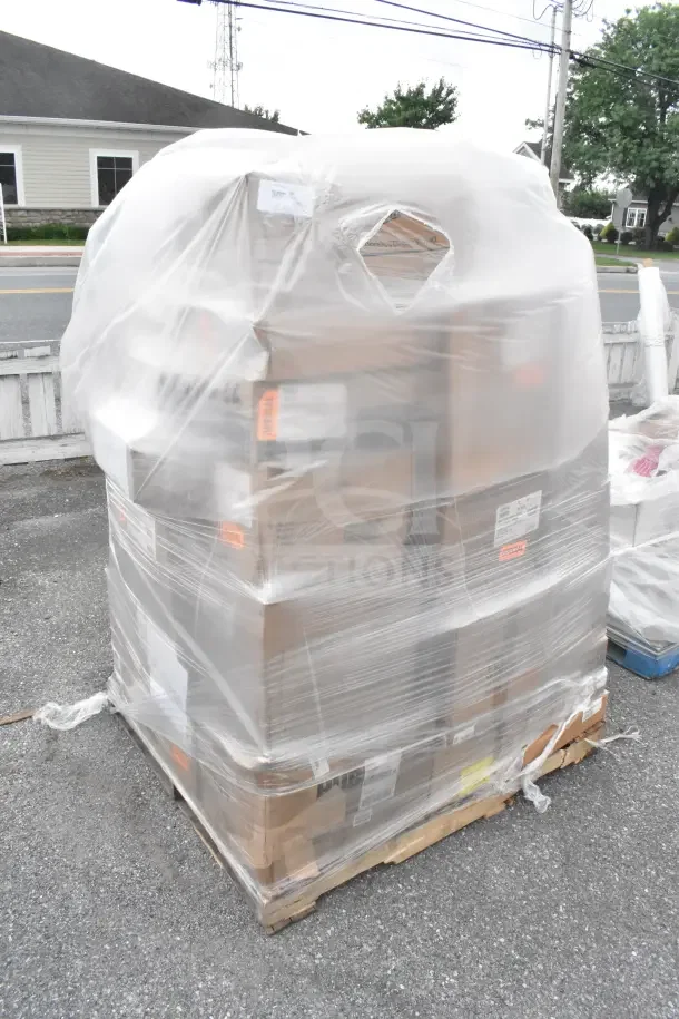 Pallet wrapped in plastic containing 37 brand new scratch and dent items, including bowls, plates, and pitchers.