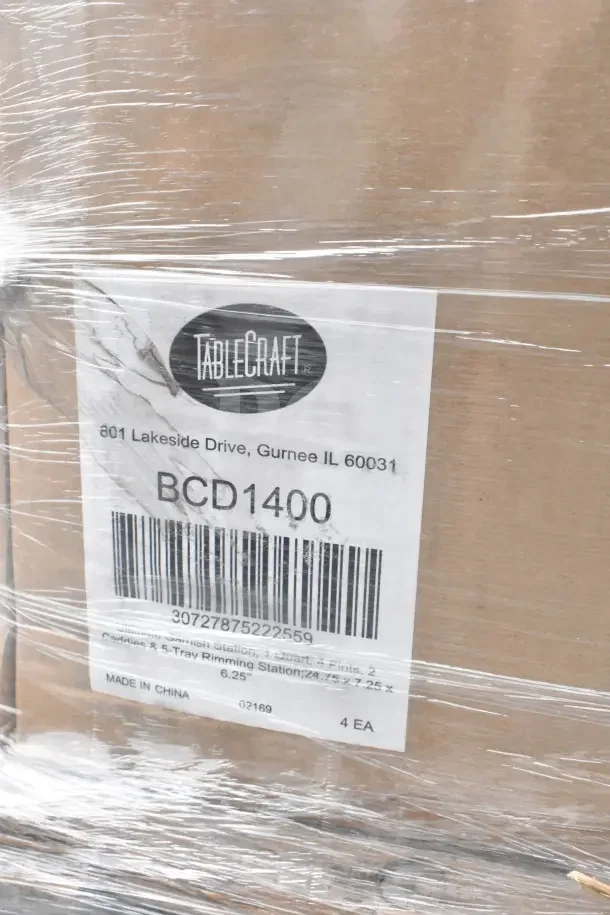 Box of TableCraft items labeled BCD1400, wrapped in plastic. Contains bowls, plates, pitchers; marked "Made in China."