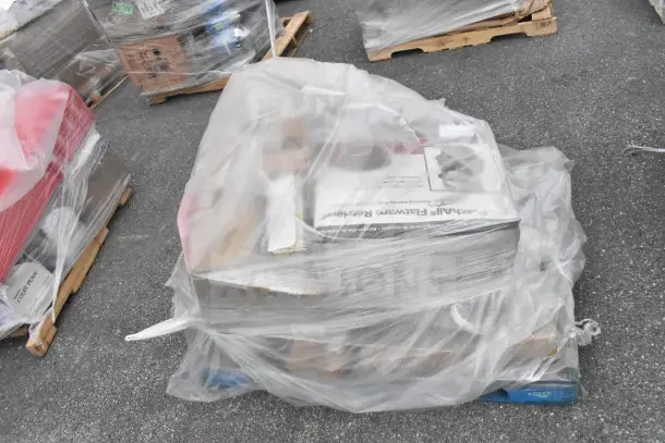 Plastic-wrapped pallet containing assorted kitchenware, including pots and pans, labeled as scratch and dent items, brand new.