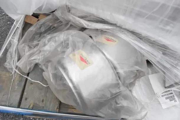 10 new scratch and dent items, including Paderno pots and deep pans, in plastic wrap. Tags show "Paderno" branding.