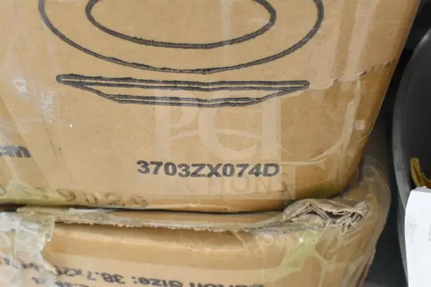 Cardboard boxes labeled "3703ZX074D," containing new scratch-and-dent pots and deep pans. Auction item.