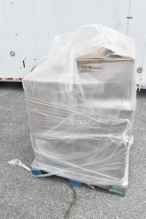 Plastic-wrapped pallet of 13 brand-new scratch and dent items including a pot, tumblers, and glasses.
