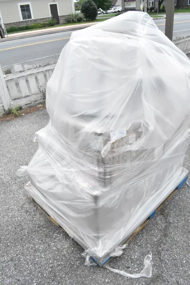 Pallet wrapped in plastic containing 13 new scratch and dent items, including pots and tumblers, partially visible.