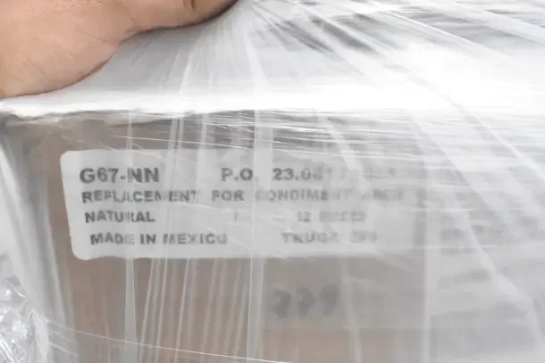 Clear plastic-wrapped package labeled "G67-NN, Replacement for Condiment Arch, Made in Mexico, 12 Pieces, Truck 320."