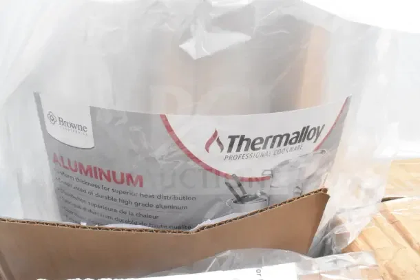 "Thermalloy aluminum pot in packaging labeled 'Browne Foodservice,' showcasing professional cookware features."