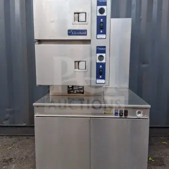 Cleveland Double Gas Steamer, stainless steel, dual control panels, Cleveland logo, used condition, industrial kitchen equipment.