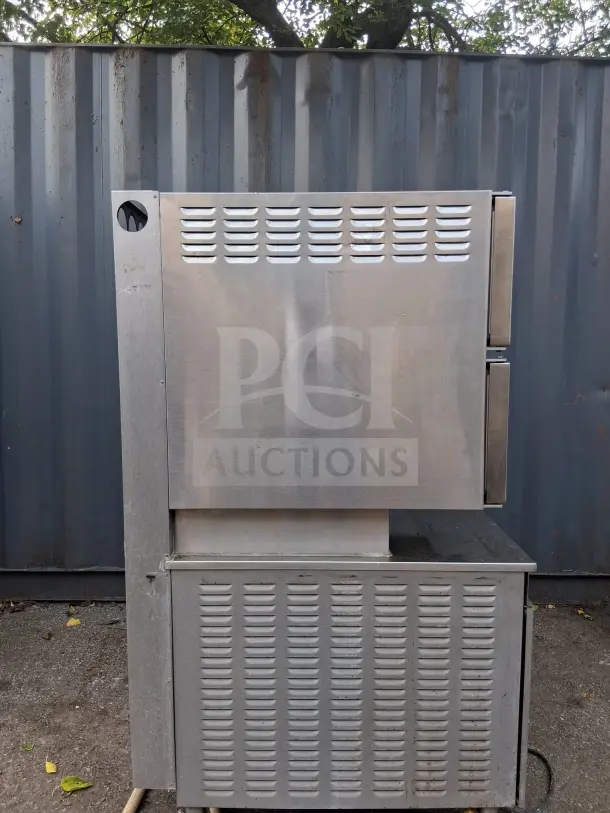 Cleveland Double Gas Steamer, stainless steel, side view, used condition, visible vents and utility connections.