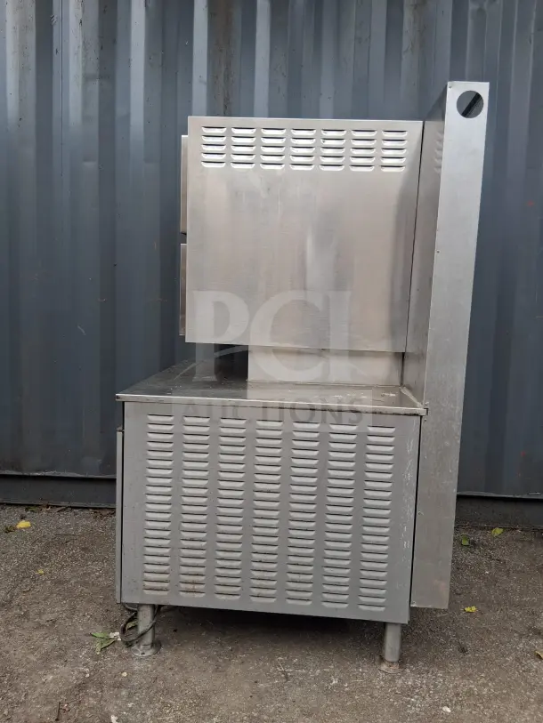 Cleveland Double Gas Steamer, stainless steel, industrial-grade, used condition, ventilation slits, suitable for commercial kitchens.