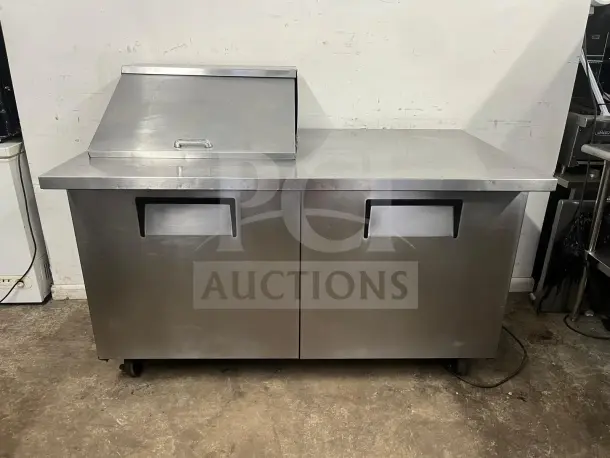 TRUE TSSU-60-12M 2 Door Mega Top Refrigerated Pizza Prep Table, stainless steel, holds 12 pans, used condition.