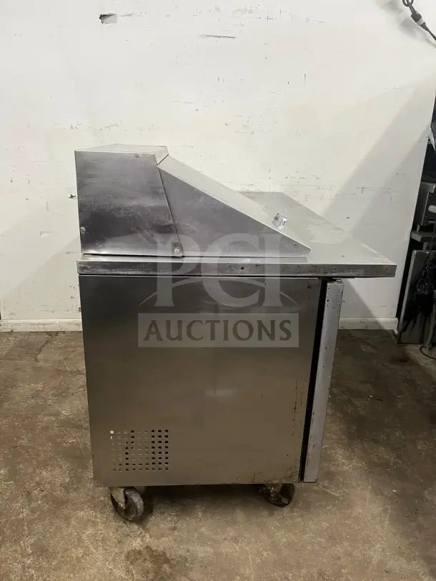 TRUE TSSU-60-12M Mega Top Refrigerated Pizza Prep Table, 2-door steel exterior, 12 pans, on casters, fair condition.