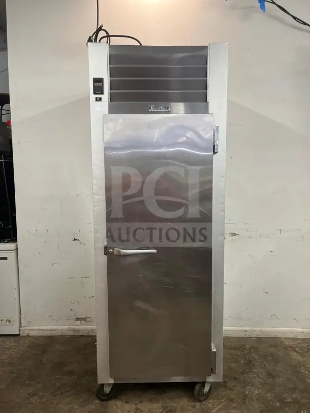 Traulsen G10010 30" reach-in refrigerator with right-hinged solid door, stainless steel, good condition, visible brand label.