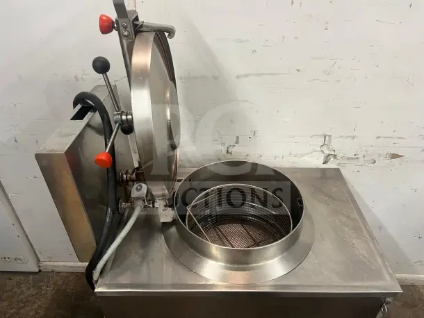 BKI FKM-F 24-inch electric pressure fryer, stainless steel, manual control, large volume, visible basket, good condition.