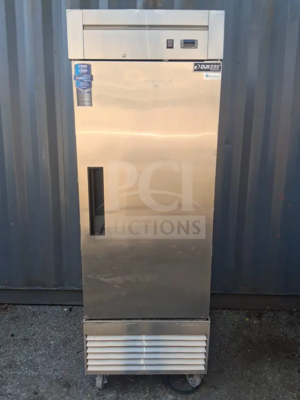 Dukers D28R commercial reach-in refrigerator, stainless steel, single door, visible warranty tag, good condition.