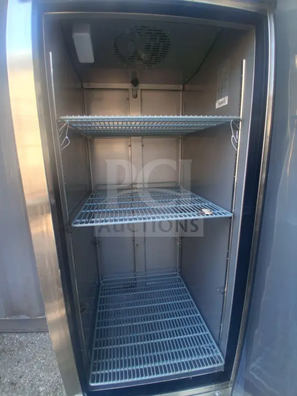 Dukers Commercial Refrigerator D28R, stainless steel, three adjustable shelves, excellent condition, interior fan visible.