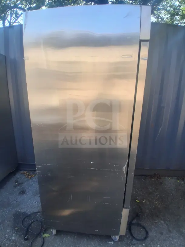 Dukers D28R Commercial Reach-In Refrigerator, stainless steel exterior, visible surface scratches.