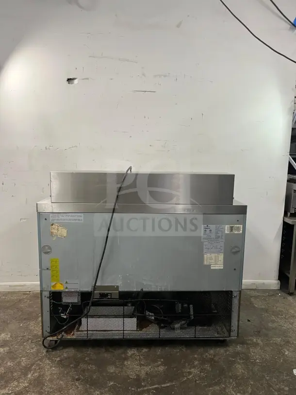 Kelvinator KCHMT48 48" mega top sandwich/salad prep table with refrigerated base, visible wear, power cord attached.