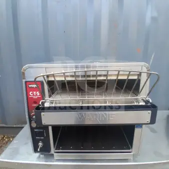 Waring CTS1000 commercial conveyor toaster, stainless steel, NSF certified, 450 slices/hour, visible brand label, used condition.