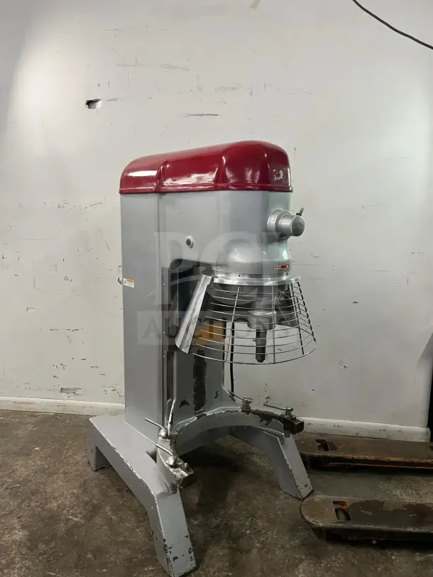 AXIS AX-M80 80 Quart Commercial Planetary Mixer, 4 Speed, 4 HP, silver and red, with safety guard. Visible wear on base.