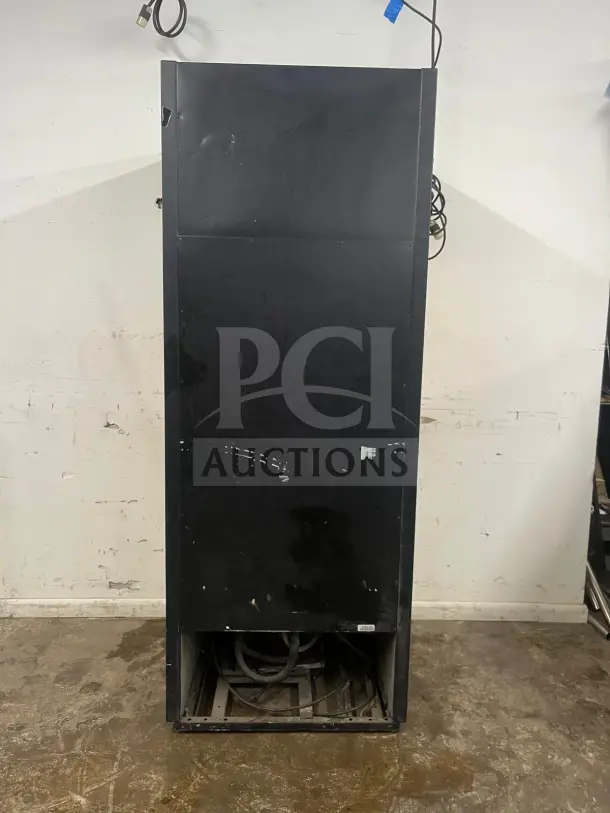 TRUE GDM-19T-LD 27" black refrigerated glass door merchandiser, visible wear, LED lighting, rear view, no travel case shown.
