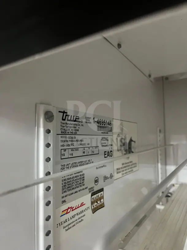 TRUE GDM-19T-LD merchandiser with LED lighting, shown with interior label detailing model and specifications. Comes with travel case.
