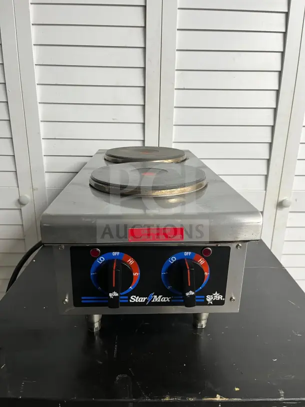 Star-Max 602HF 12" electric hot plate, dual burners, stainless steel, good condition, labeled controls, caution hot notice.