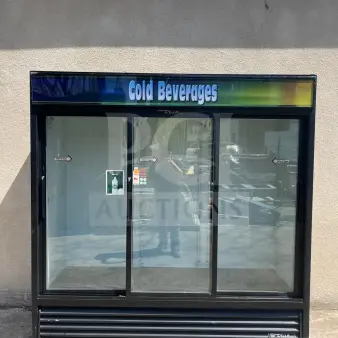 True GDM-69-HC-LD merchandiser, 78 1/8", three sliding glass doors, black, used condition, labeled "Cold Beverages."