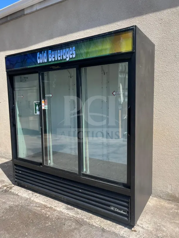True GDM-69-HC-LD glass door merchandiser, 3 sliding doors, black, "Cold Beverages" sign, good condition, 115v.